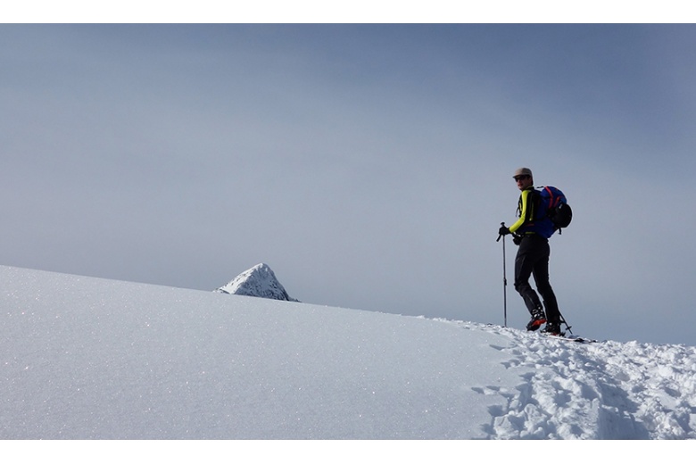 top of the montardo on image from the salana with skier on his way to the summit