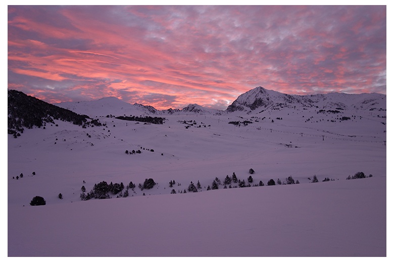 beautiful image of the beret area of the Baqueira-Beret ski resort at sunrise with the tuc de beret far left