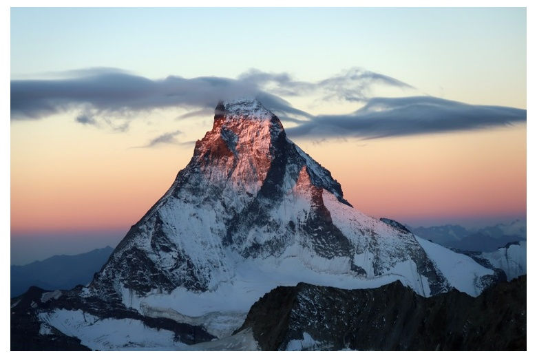 view of the north face of the matterhorn, orange sky on sunset