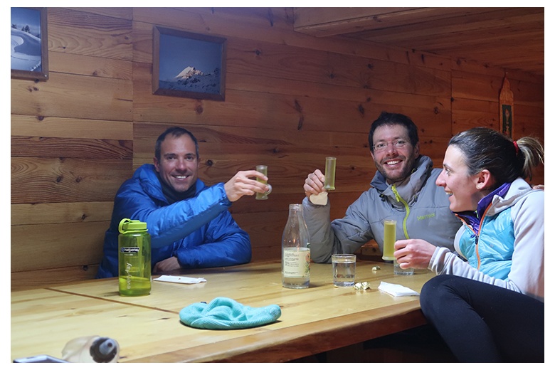 group of people having a drink inside saboredo hut