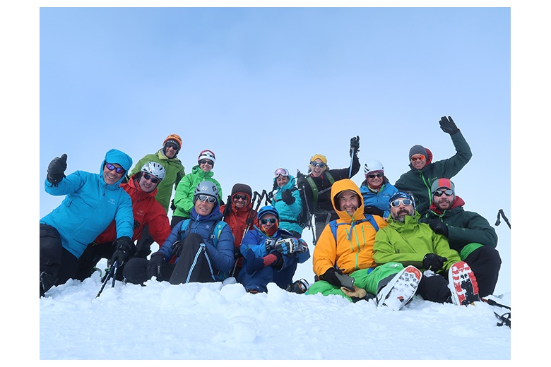 group of skiers celebrating the summit at tuc de monges