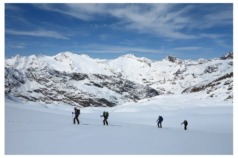 skiers crossing the glacier