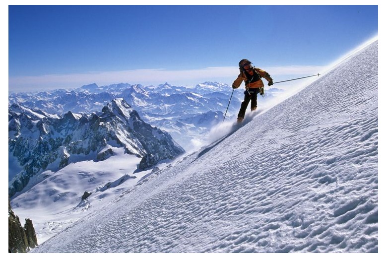 skier descending the Mont Blanc with magnificient view on the background